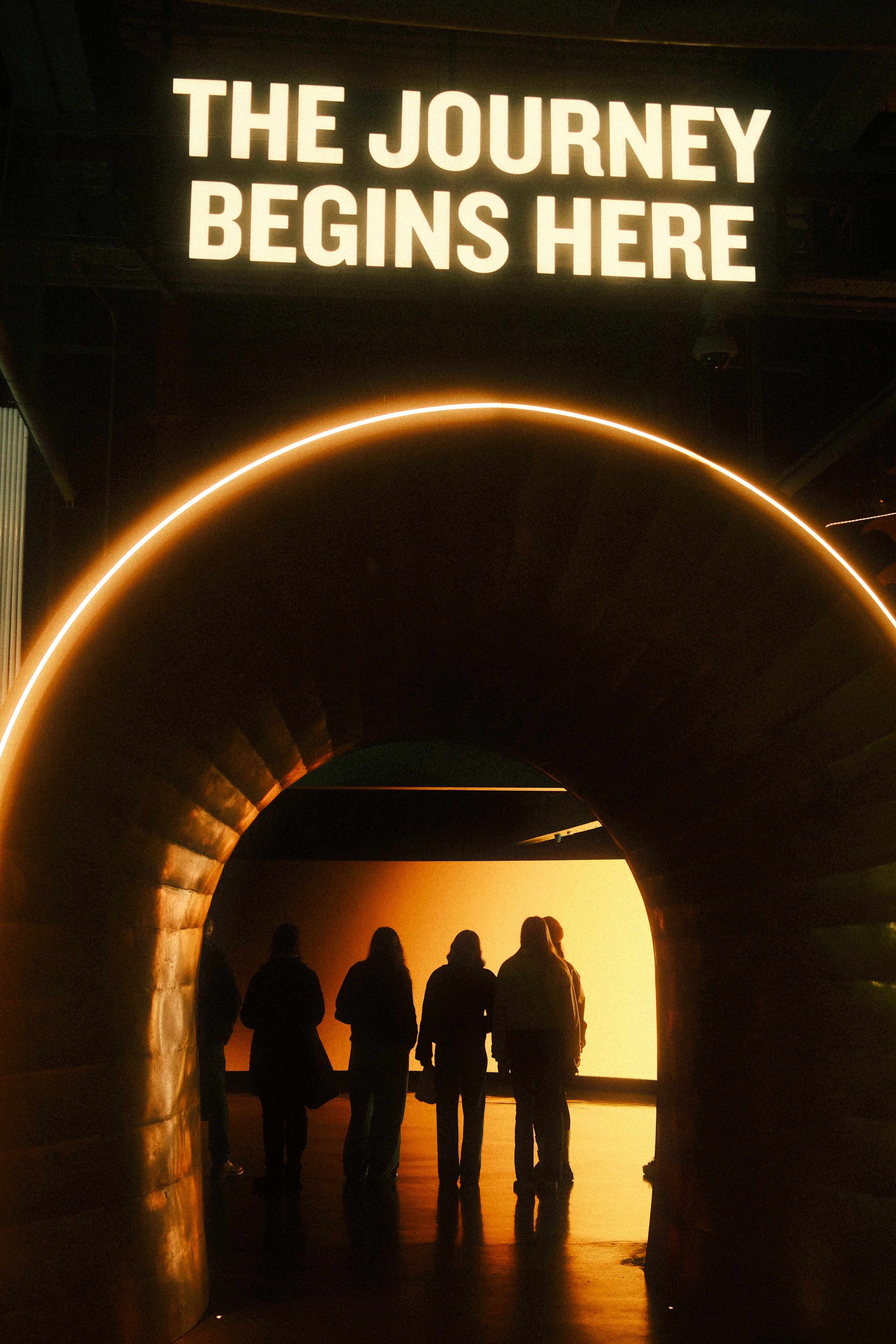 Illuminated archway: the journey begins here